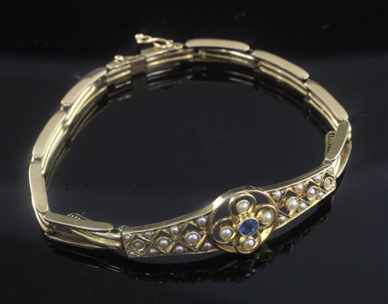 An Edwardian pierced 15ct gold, sapphire and split pearl set expanding bracelet, 6.25in.